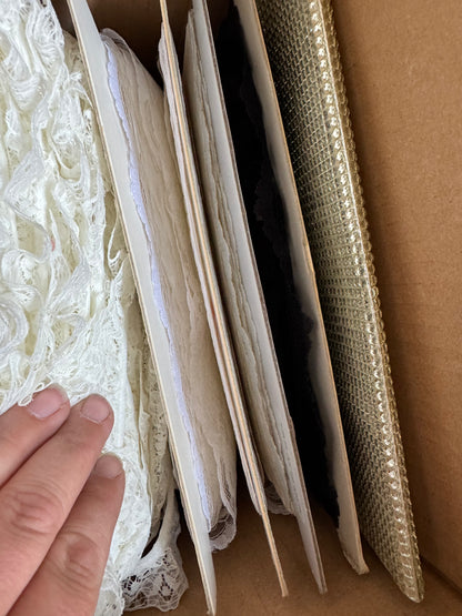 Box of trims, lace, pearls & tulle.